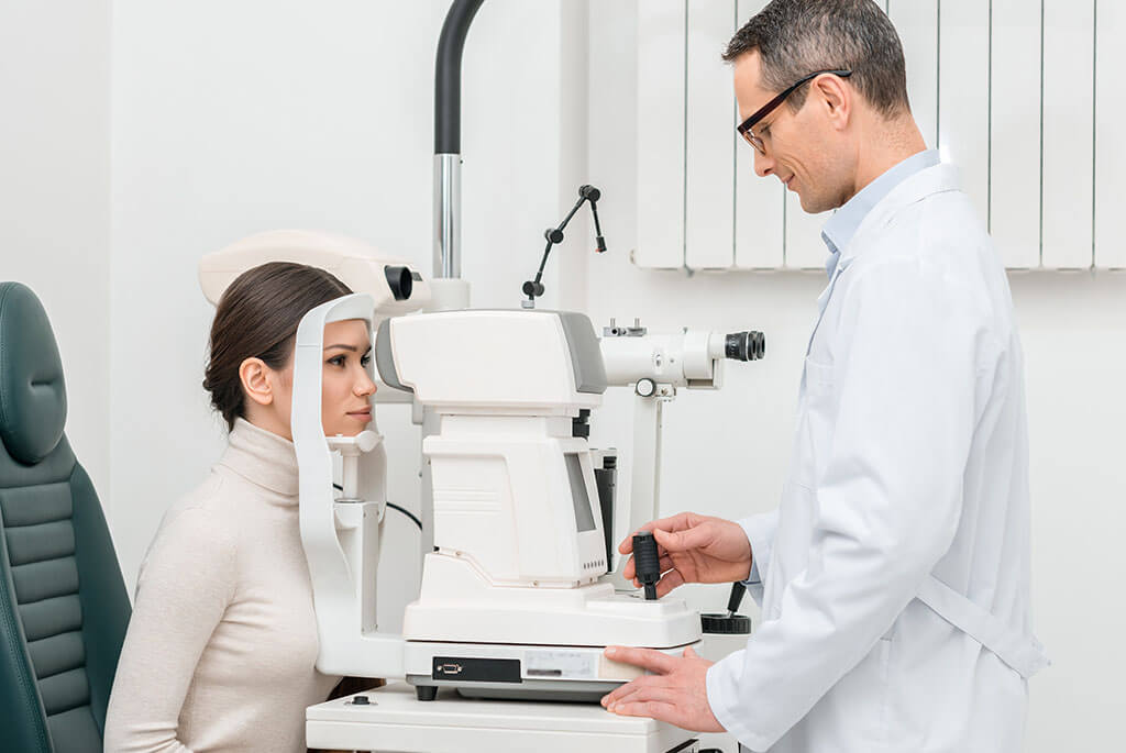 Doctor Inspecting Eye Of A Patient