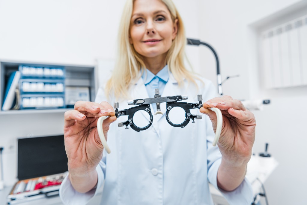 Doctor Inspecting Eye Of A Patient
